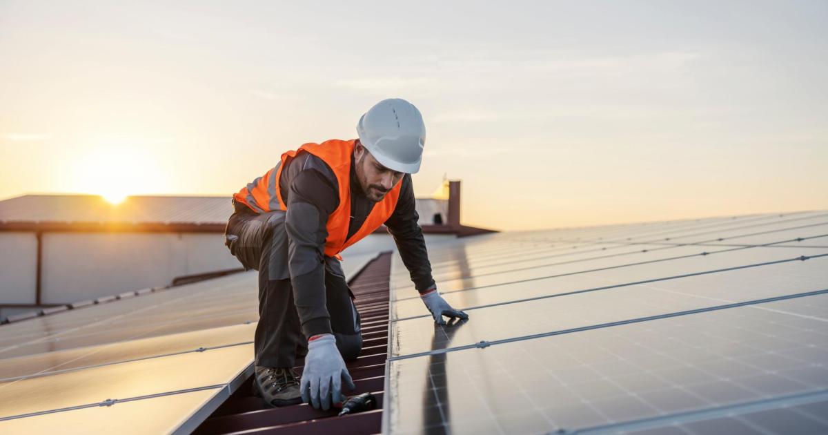 Worker on solar panel